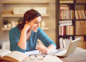 beautiful young woman working at home